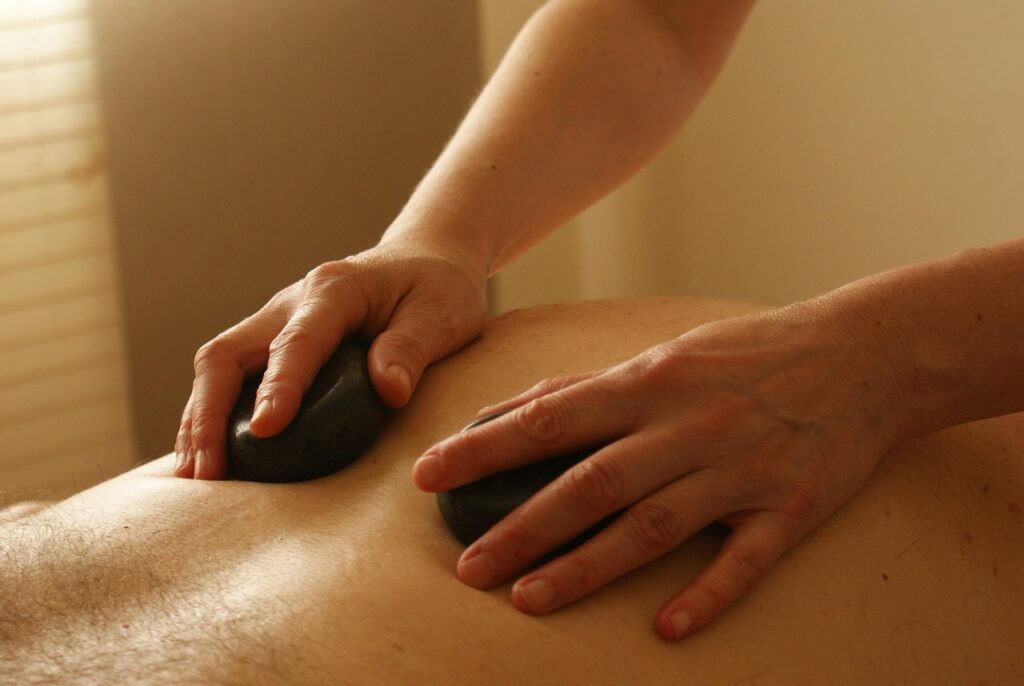 Heated volcanic stone therapy for deep relaxation at Arowa Luxury Spa Banani.