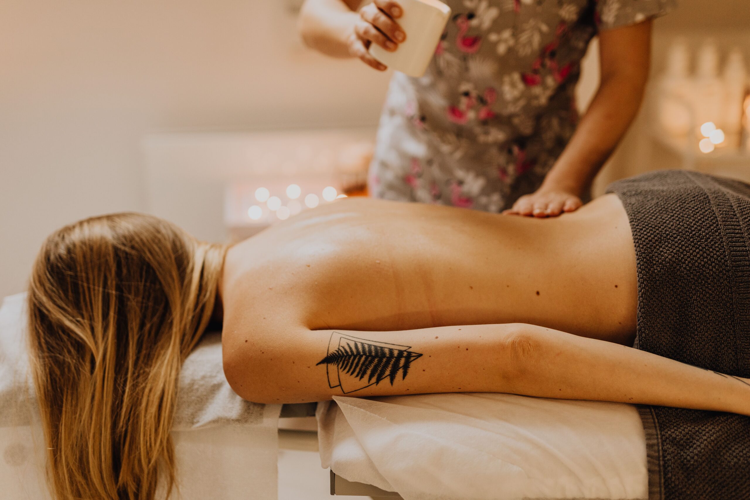 Warm organic oil massage for skin nourishment and muscle ease at Arowa Luxury Spa.